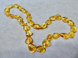 AMBER SMALL FLAT CLEAR GRADUATED BEAD NECKLACE 18"